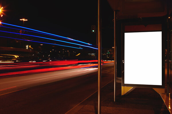 Blank billboard with night city on background