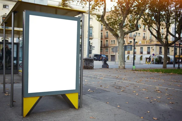 Illuminated blank billboard in urban setting — Stok fotoğraf