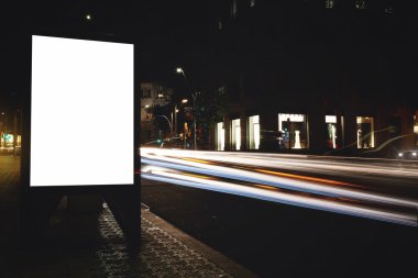 Blank billboard with night city on background
