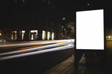 Blank billboard with night city on background