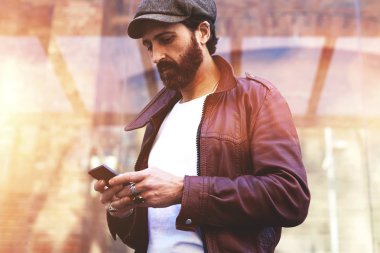 Man with mobile phone in urban setting