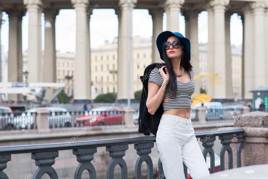 Young trendy woman posing in the street