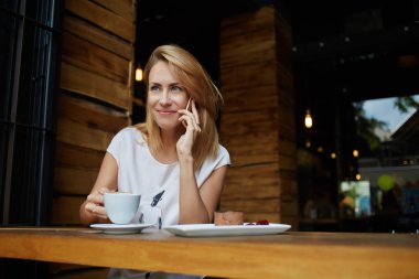 Woman having mobile phone conversation