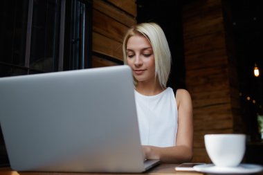Elegant businesswoman working on laptop computer