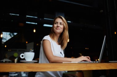 woman working on portable net-book