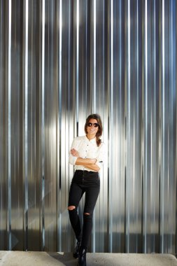 Model in black sunglasses posing outdoors