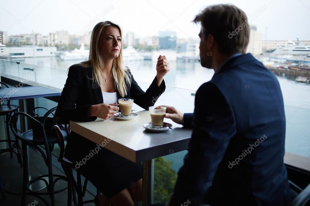 Business partners sitting in cafe terrace