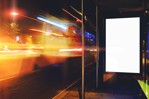 Electronic blank billboard with copy space for your text message or promotional content, clear public information board in night city with cars's movement on background, bus stop advertising mock up