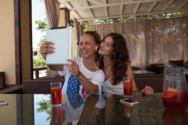 Smiling women making self portrait — Stock Photo, Image