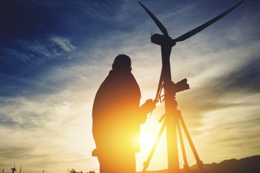 Silhouette of a male surveyor