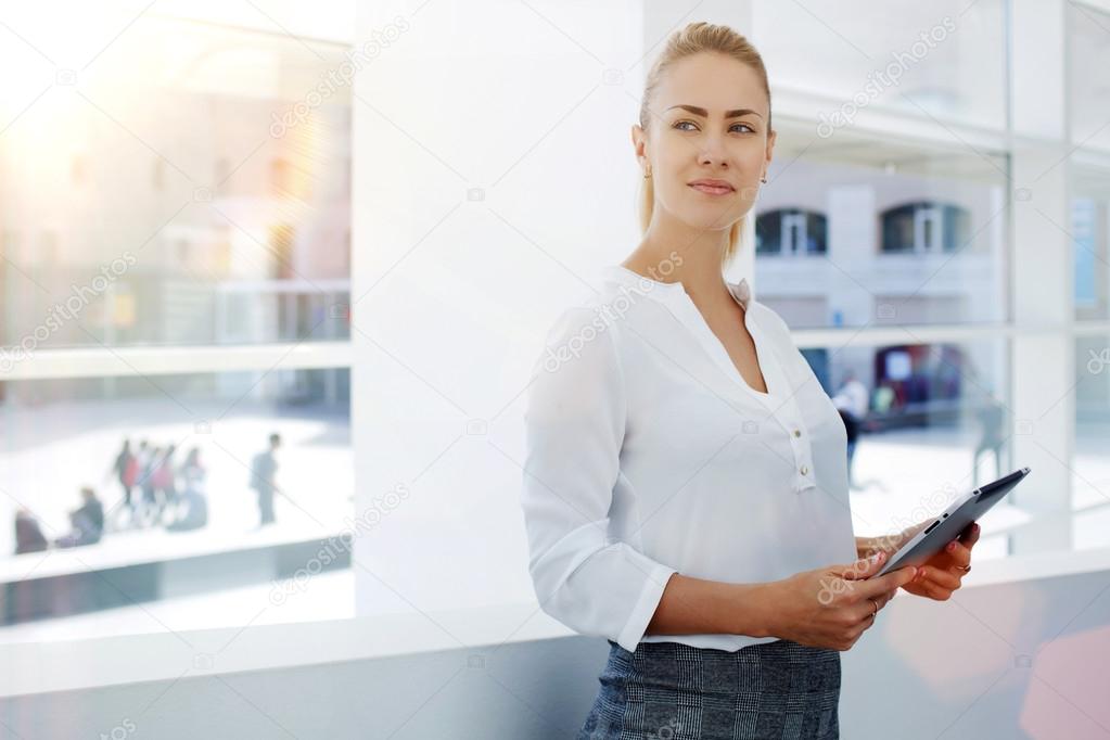 businesswoman holding digital tablet in hands
