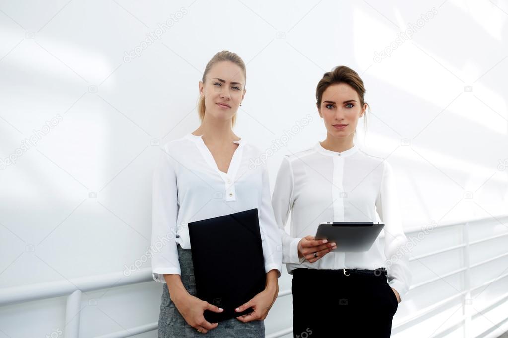 women with touch pad and folder documents