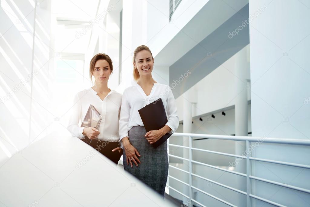 women with touch pad and folder documents