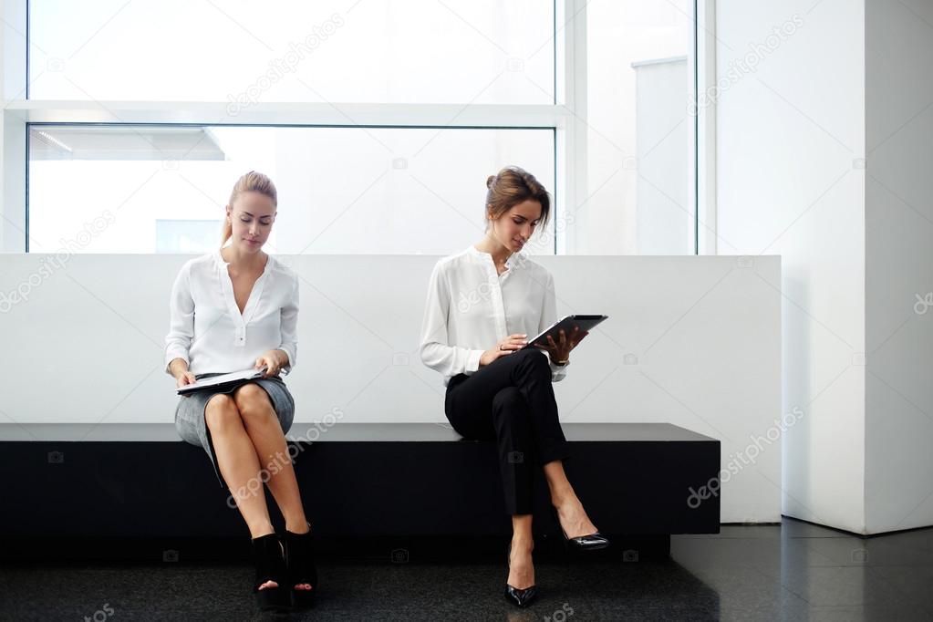 Two women financiers preparing for interview