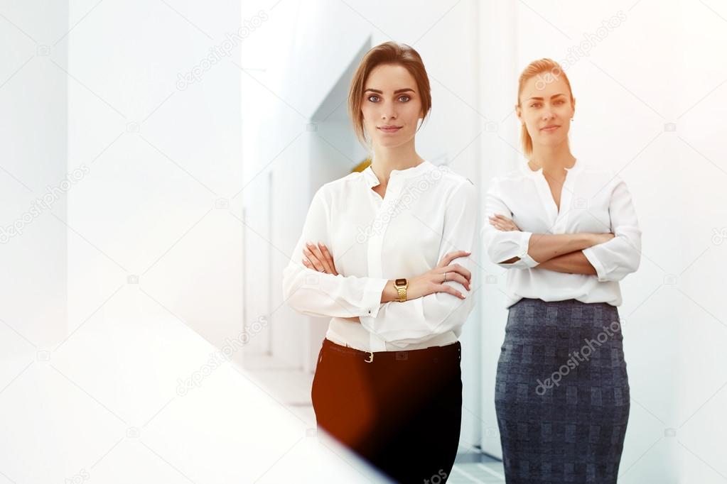 successful women standing in modern office