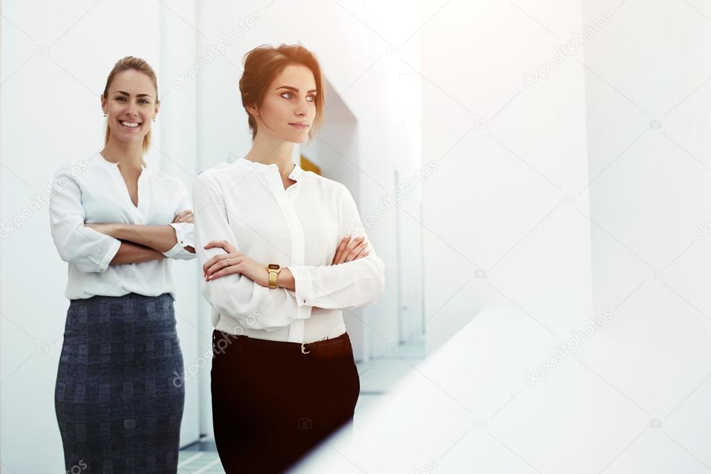 successful women standing in modern office