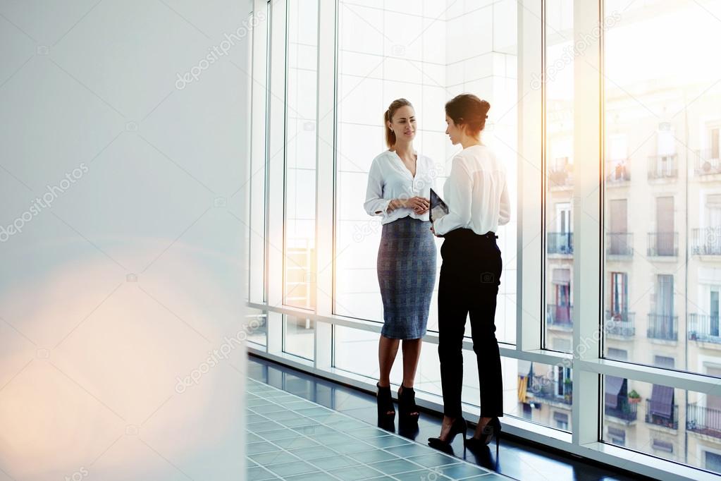 Two businesswomen having conversation