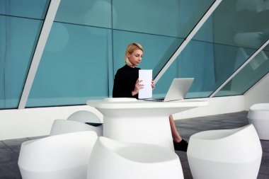 woman employer holding paper work