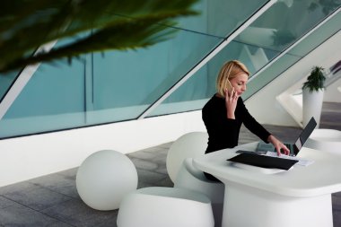 female talking on cell telephone