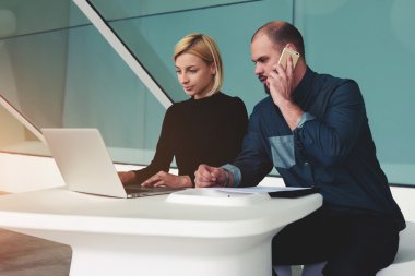 two confident business workers