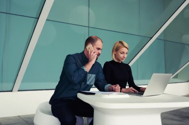 male and female economists in office