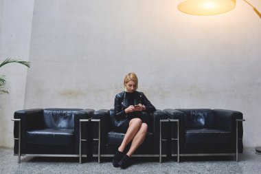 woman writing message on mobile phone
