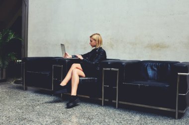 woman sitting with open net-book