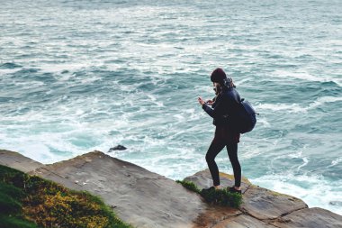 woman tourist using mobile phone