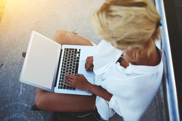 Female watching videos on portable net-book — Stok fotoğraf