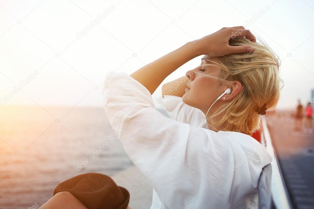 woman listening to music in headphones