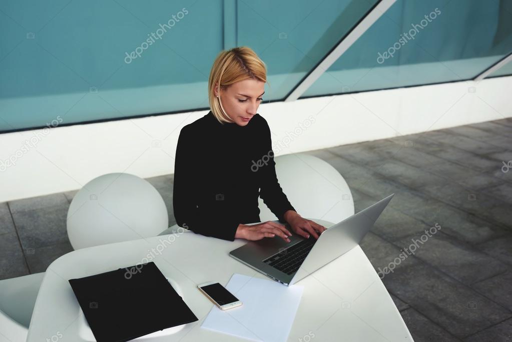 Woman doing monthly report on net-book