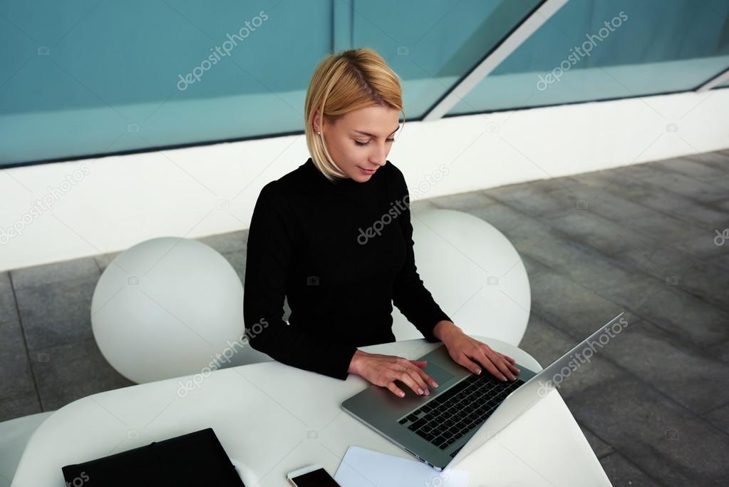 businesswoman keyboarding on net-book