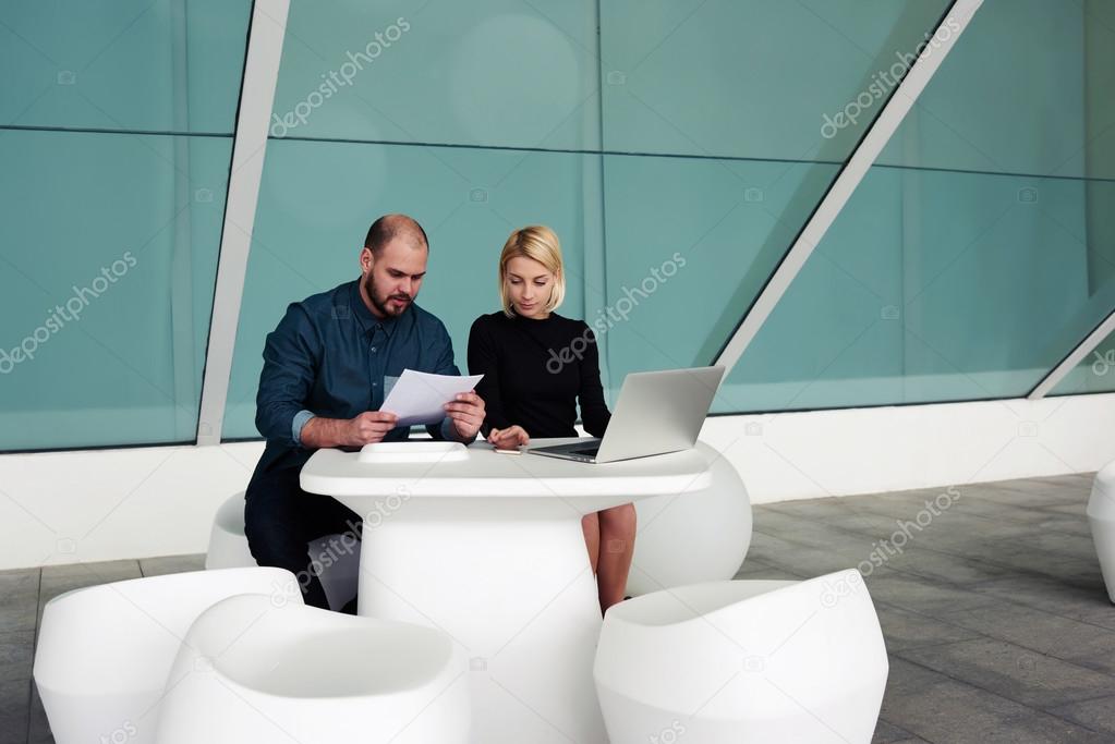 man and woman leaders using laptop