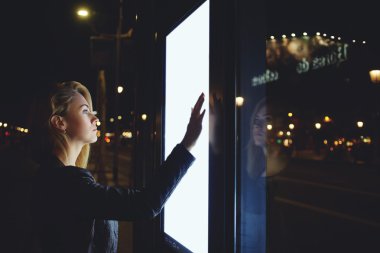 woman tourist using modern digital display