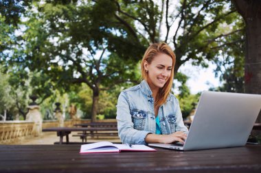 woman student using portable laptop