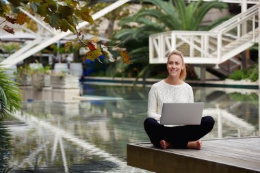 woman checking email on netbook