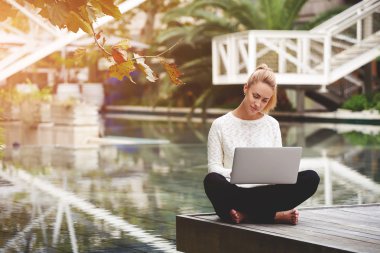 woman checking email on netbook