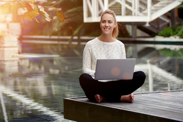 woman checking email on netbook