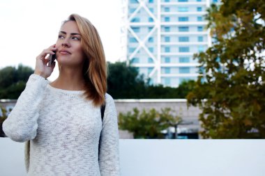 woman having mobile phone conversation
