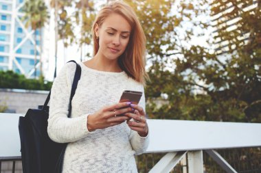 hipster girl reading text message