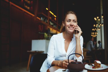 woman having conversation on cell telephone