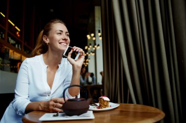 hipster girl holding smart phone