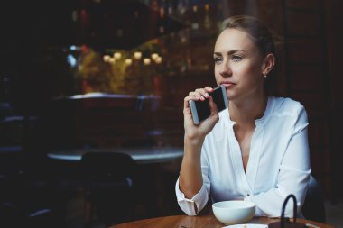 Young businesswoman with cell telephone
