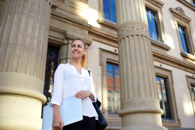 student posing with portable netbook