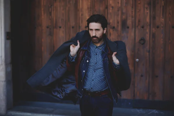 Adult man holding coat — Stock Photo, Image