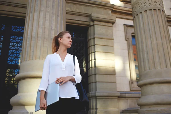 Woman with closed netbook — Stock Photo, Image