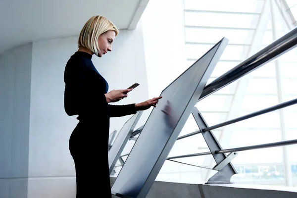 Young businesswoman using interactive display — Stock Photo, Image