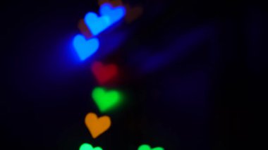 Renk bokeh ışığı soyut kalp arka planı. Sevgililer Günü konsepti. 