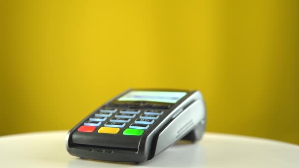 Payment terminal on color background. Banking concept. Contactless payment. — Stock Video