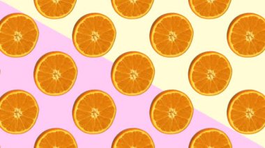 Turuncu renk arkaplanında döner. Soyut animasyon. Meyve, pop sanat tarzı.